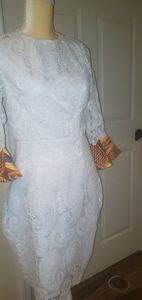 Beautiful white dress design with a Weaved kente